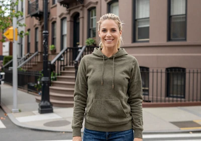 Brianna, a 30-year-old blonde woman in a hoodie on a Brooklyn street, representing trucker dating in New York