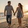 Marcus and Danielle, a couple walking barefoot on a Florida beach at sunset, a MileDating trucker dating success story